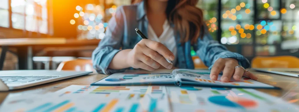 a freelancer studying an informative infographic from goseo local pro, surrounded by various top seo tools for enhancing online visibility.