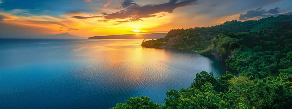 a vibrant sunset casts a golden glow over a tranquil lake, reflecting the fiery hues of the sky and surrounded by lush, emerald greenery.