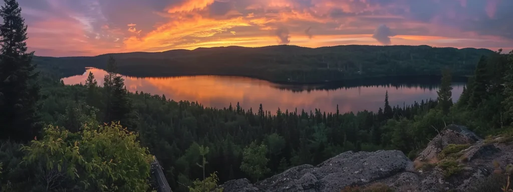 a vibrant sunset casts golden hues over a serene lake, reflecting the colorful sky and surrounded by lush green trees, creating a tranquil and picturesque landscape.